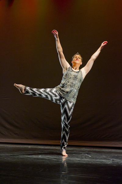 A photo of a dancer on stage. 