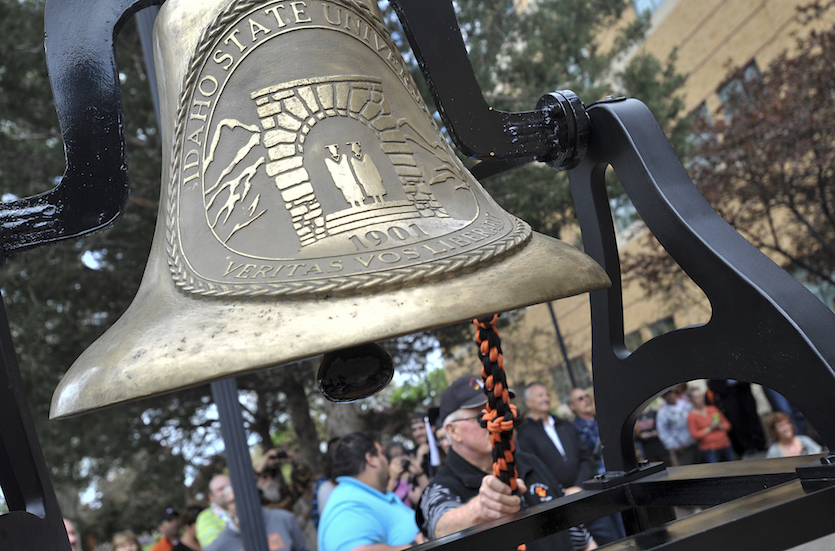 Picture of someone ringing graduation bell at March through the Arch