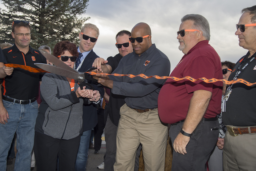 Dignitaries cutting ribbon at the 2016 year's I Love ISU breakfast