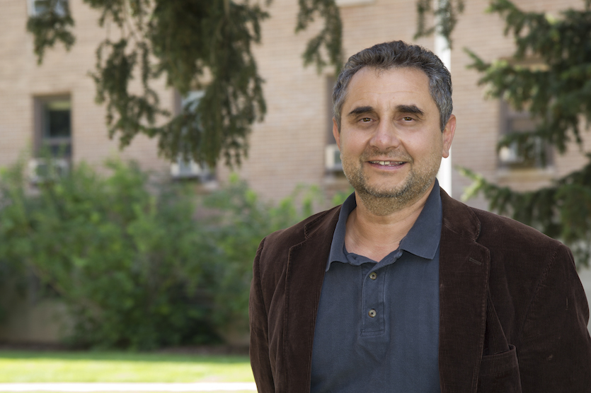 Photo of Ed Tator standing on Hutchinson Quadrangle