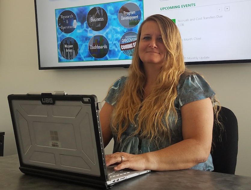 Photo of Tami Musante at her desk. 