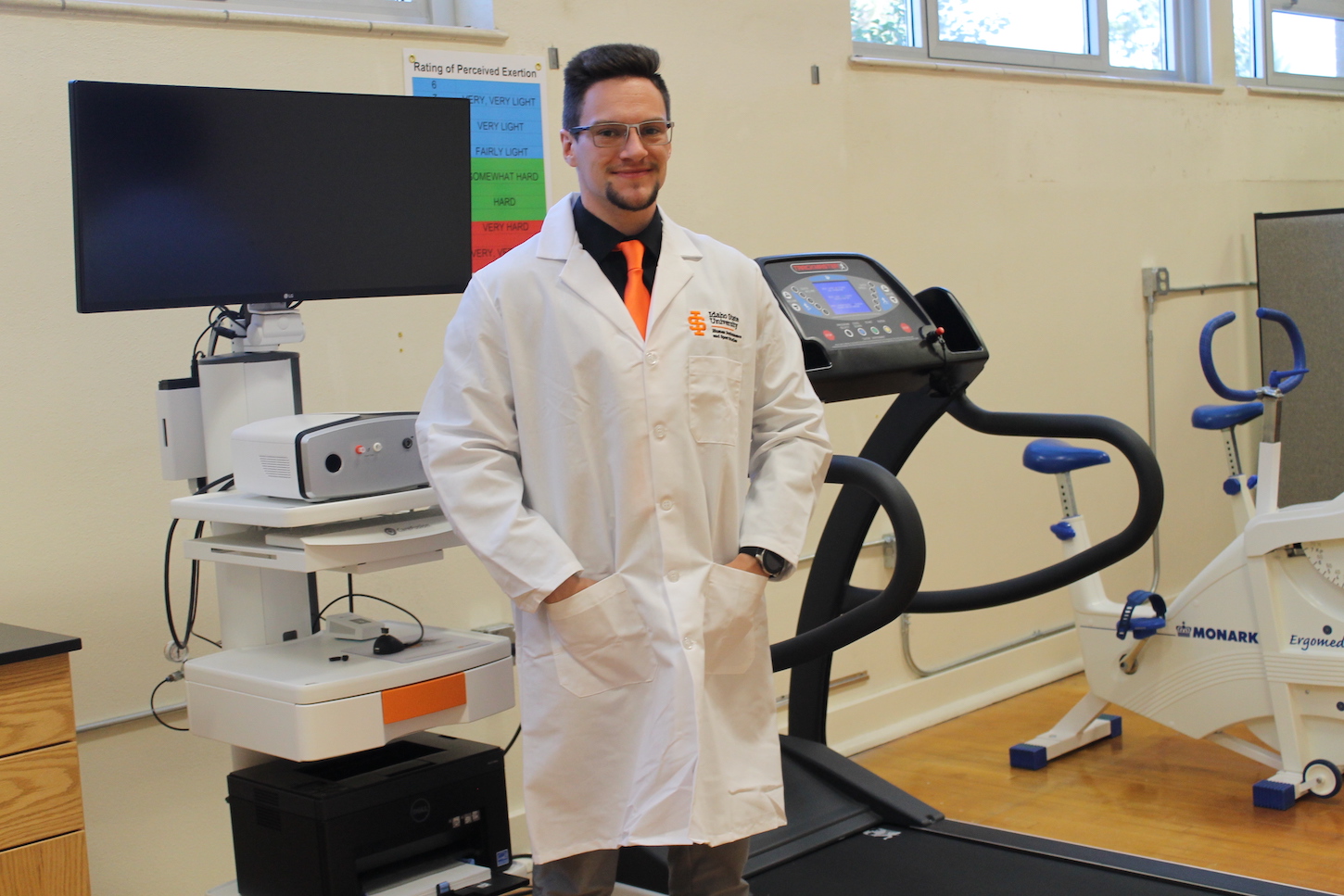 Jarret Mitton stands in a laboratory