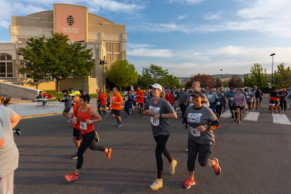 Participants in the annual Run for Funds start the race at the Stephens Performing Arts Center