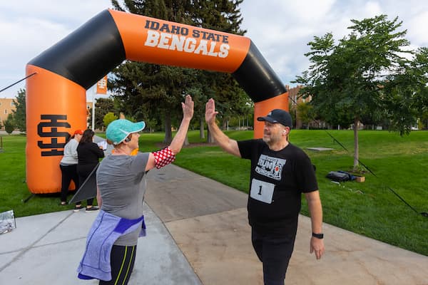 President Kevin Satterlee celebrating with participants in the annual Run for Funds race