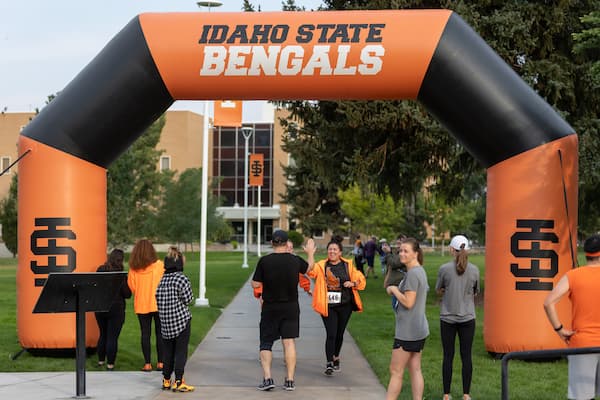 Racers cross the finish line at Kevin's Run for Funds on Saturday, September 17, 2022.