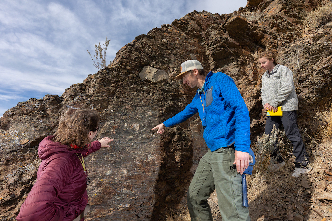 Kendra Murray, assistant professor of geosciences, left, Dave Pearson, associate professor of geosciences, center, and Anna Miller, master’s student, inspect a rock outcropping in Pocatello, Idaho on Tuesday, November 01, 2022.