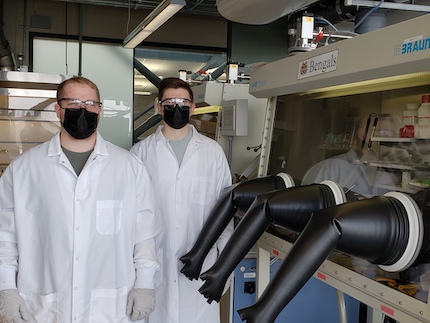 Idaho State University Nuclear Engineering students, Morgan Robbins, left, and Jordan Harley, right, pose for a picture in a laboratory at the Center for Advanced Energy Studies in Idaho Falls, Idaho.