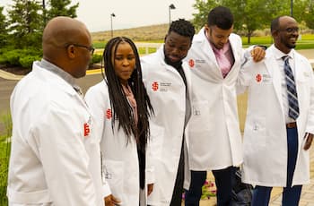 Students pose for a photo during the White Coat Ceremony