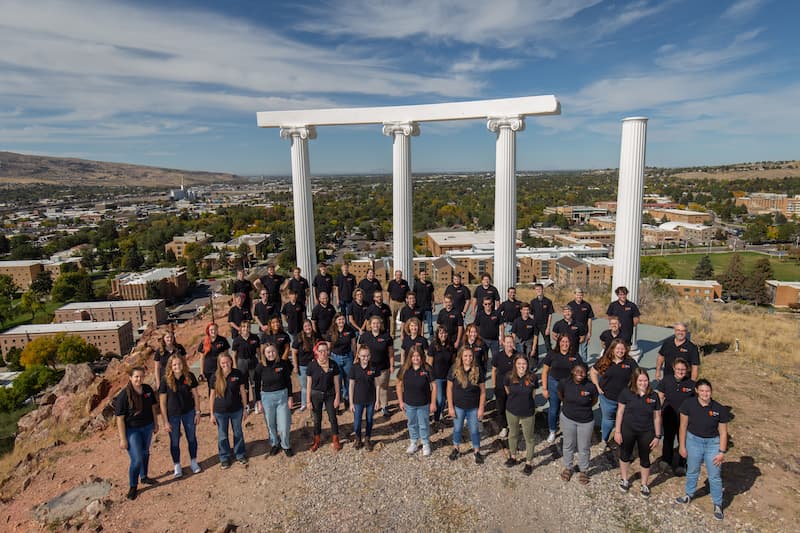 Students from the ISU Choir pose for a photo at the Red Hill Pillars.