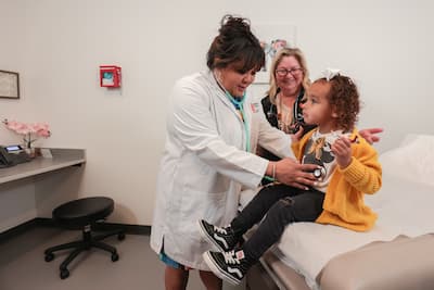 Nurse practitioner examines a patient