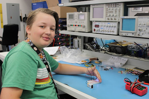 A boy with a science experiment