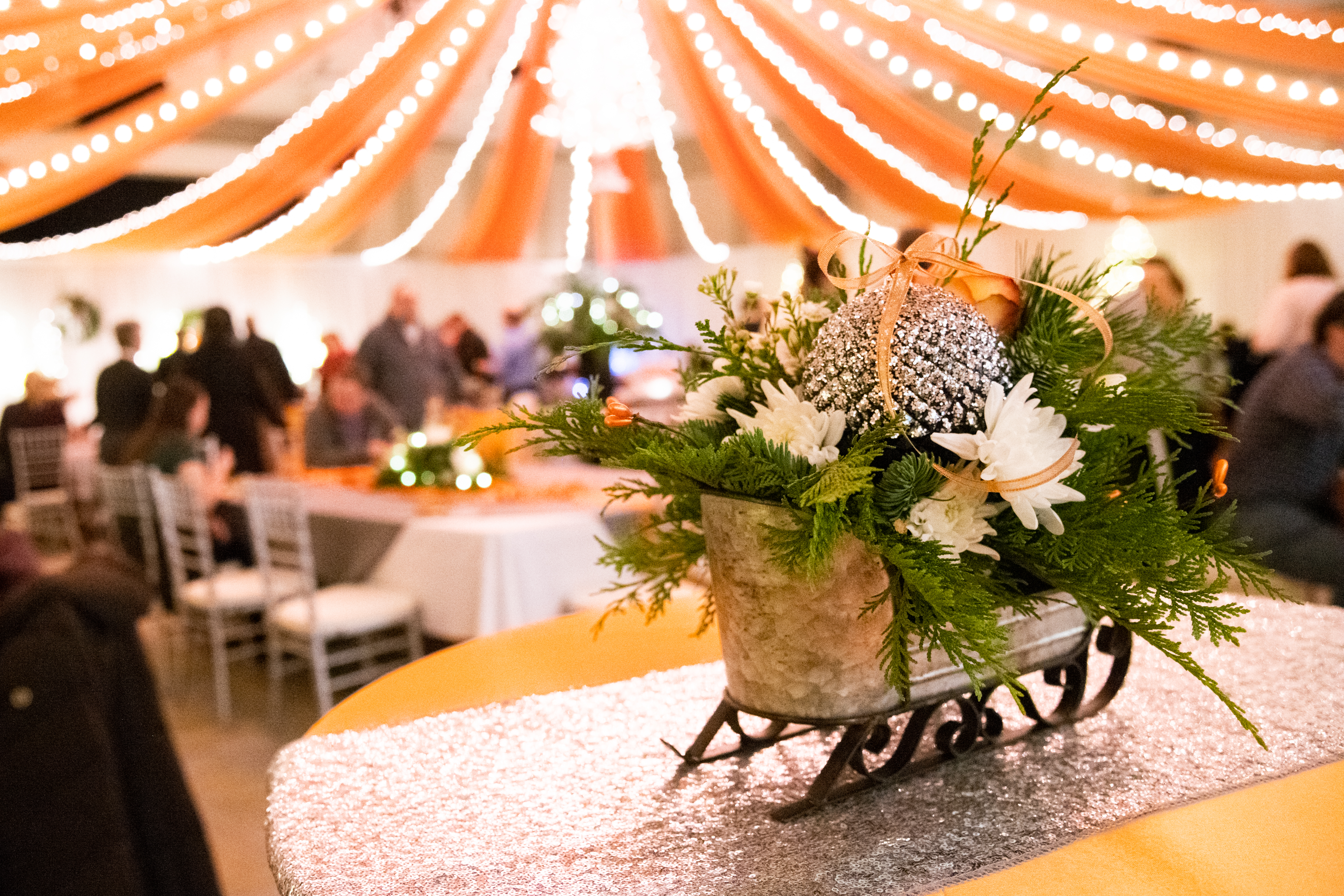 Sparkly sleigh on a decorated table at the annual holiday open house