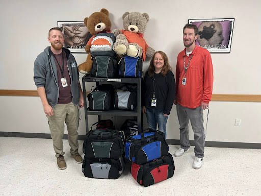 Students in a grant writing class at ISU help gather and distribute duffle bags full of hygiene items and other essentials for local high school students.