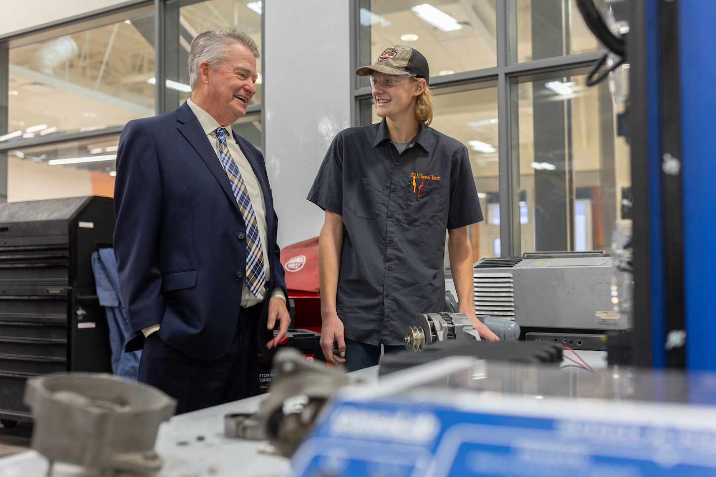 Governor Brad Little talks with a student