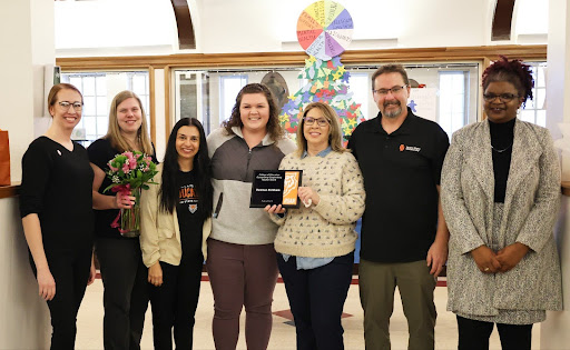 ISU College of Education faculty and staff and teacher candidate Kinsey Isham celebrate Mrs. Dawnae Kirkham at Pocatello High School.