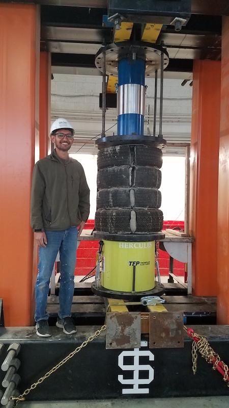 Man with a stack of tires