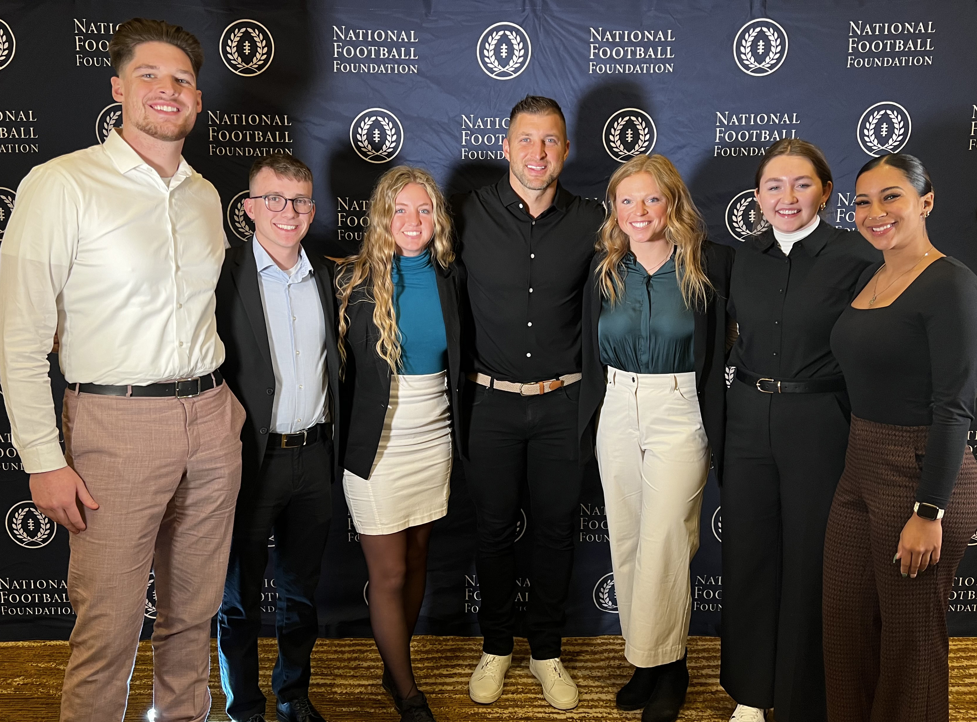 ISU Students with football legend, Tim Tebow, at the National Football Foundation College Football Award Ceremony