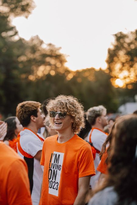 A student smiles at convocation