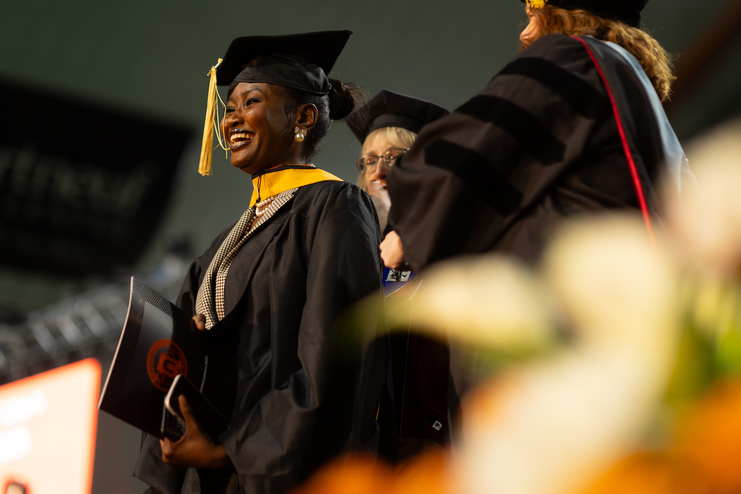 Woman receives her master's hood