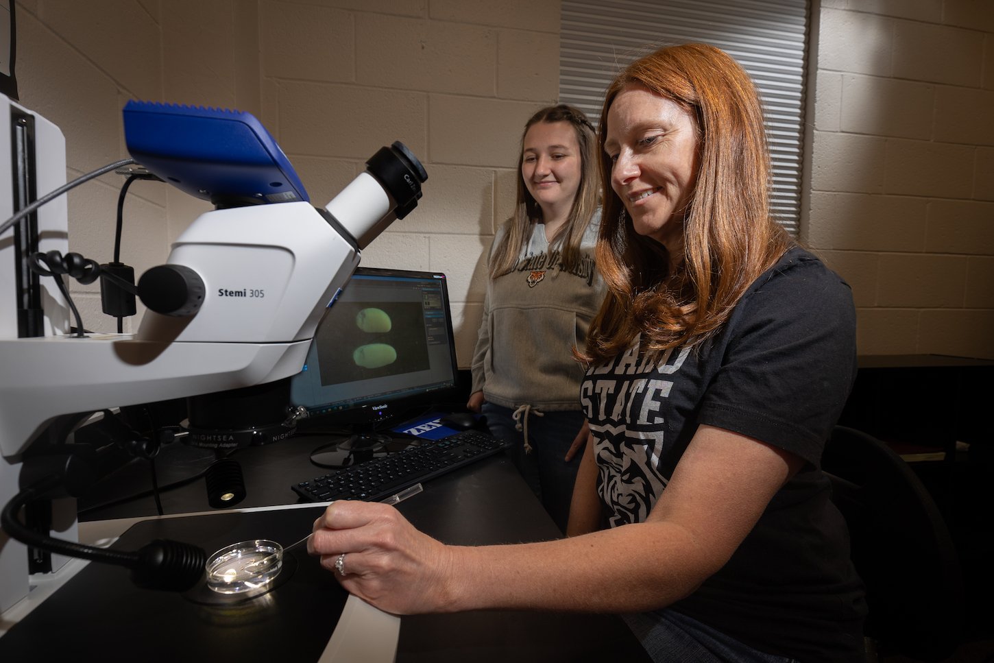 Two women work in a laboratory