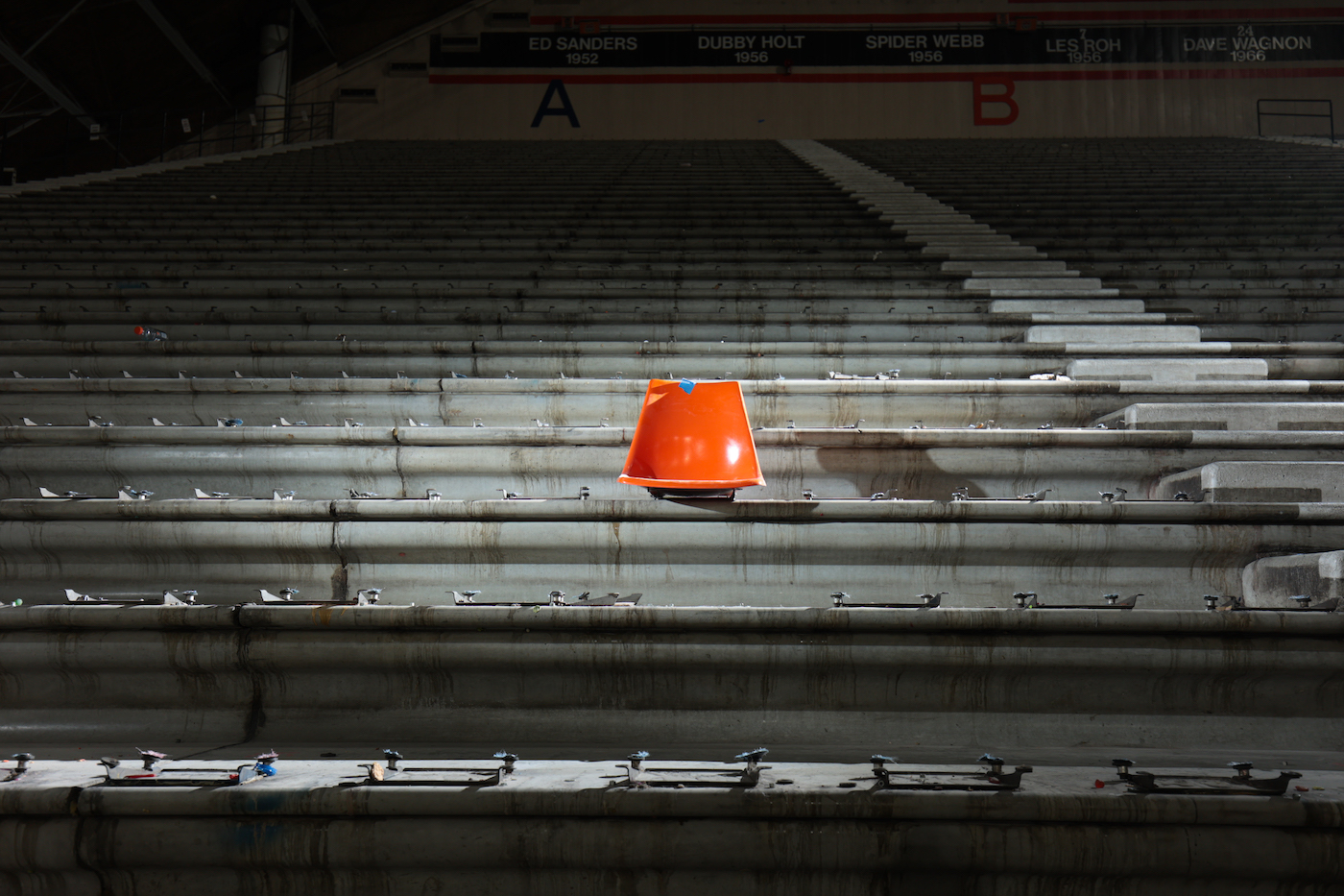 A single orange chair is shown at Holt Arena.