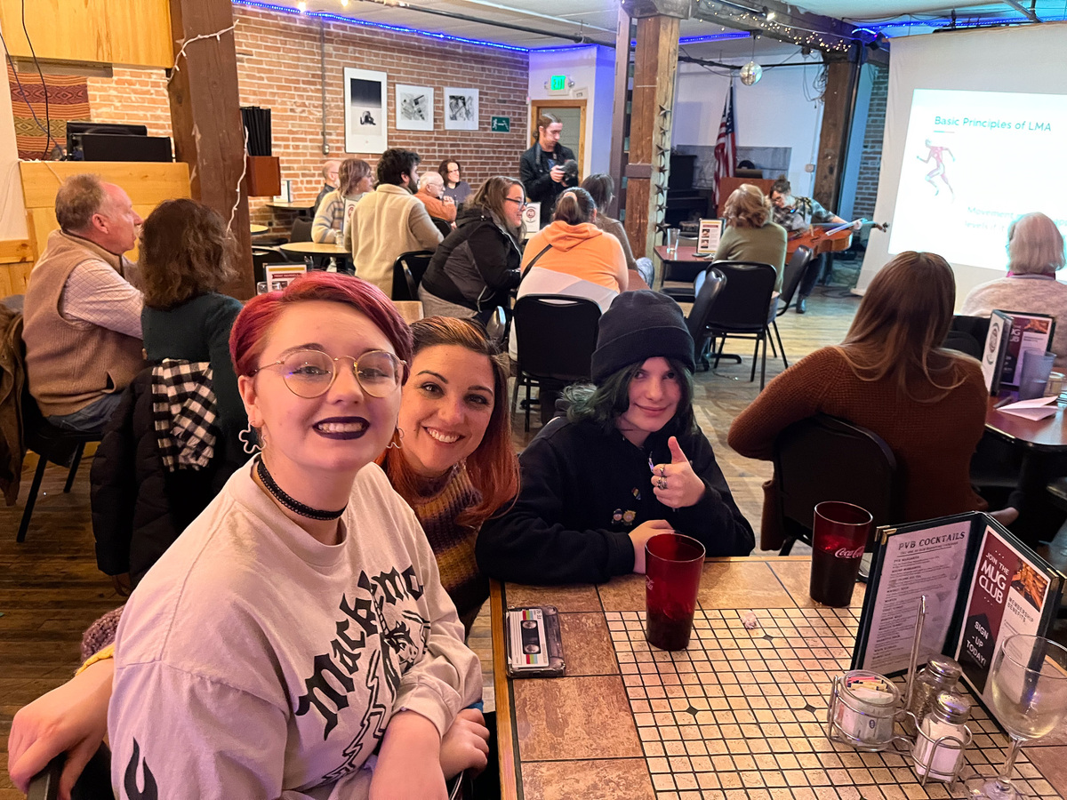 Students enjoy the Humanities Café Community Event at a brewery table