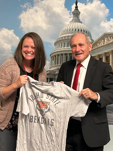 Senator Risch and a student hold up a t-shirt