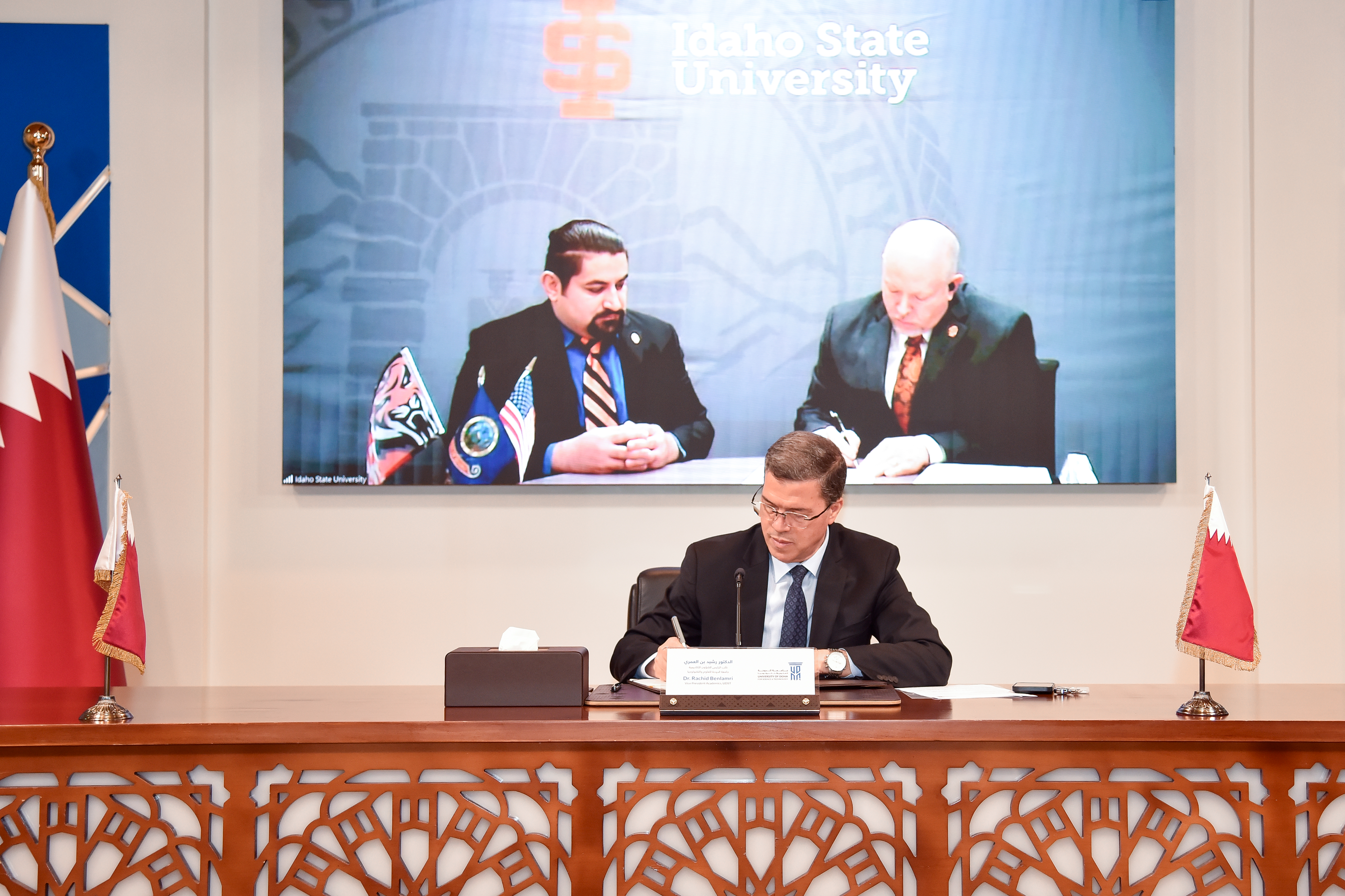 Representatives from ISU and UDST sign MOU via Zoom