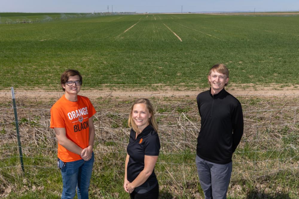 Zachery McLane, student, Cori Jenkins, associate professor of chemistry at Idaho State University, and Cal Norby, student, pose for a photo.