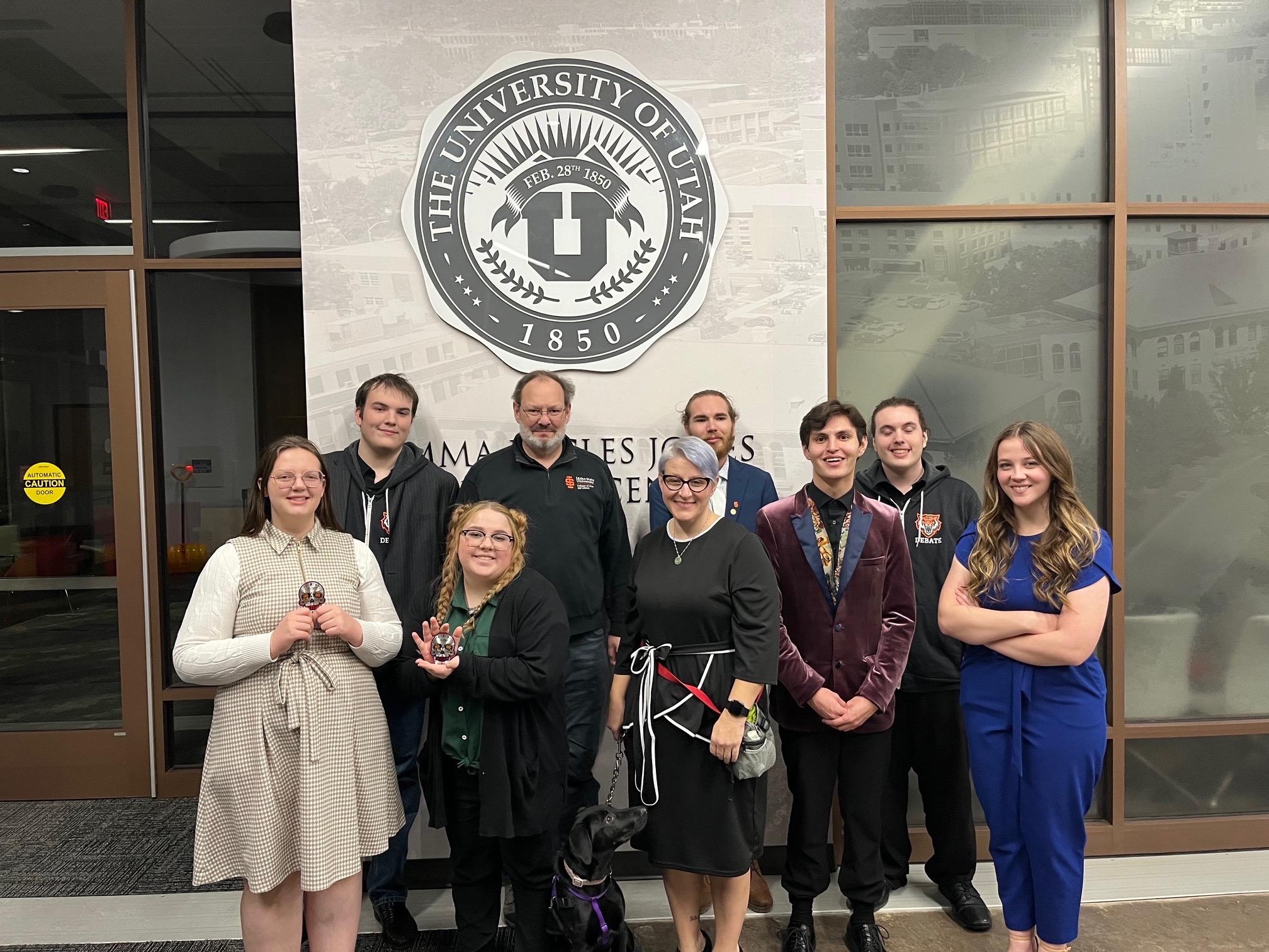 Members of the ISU debate team hold trophies at a recent conference