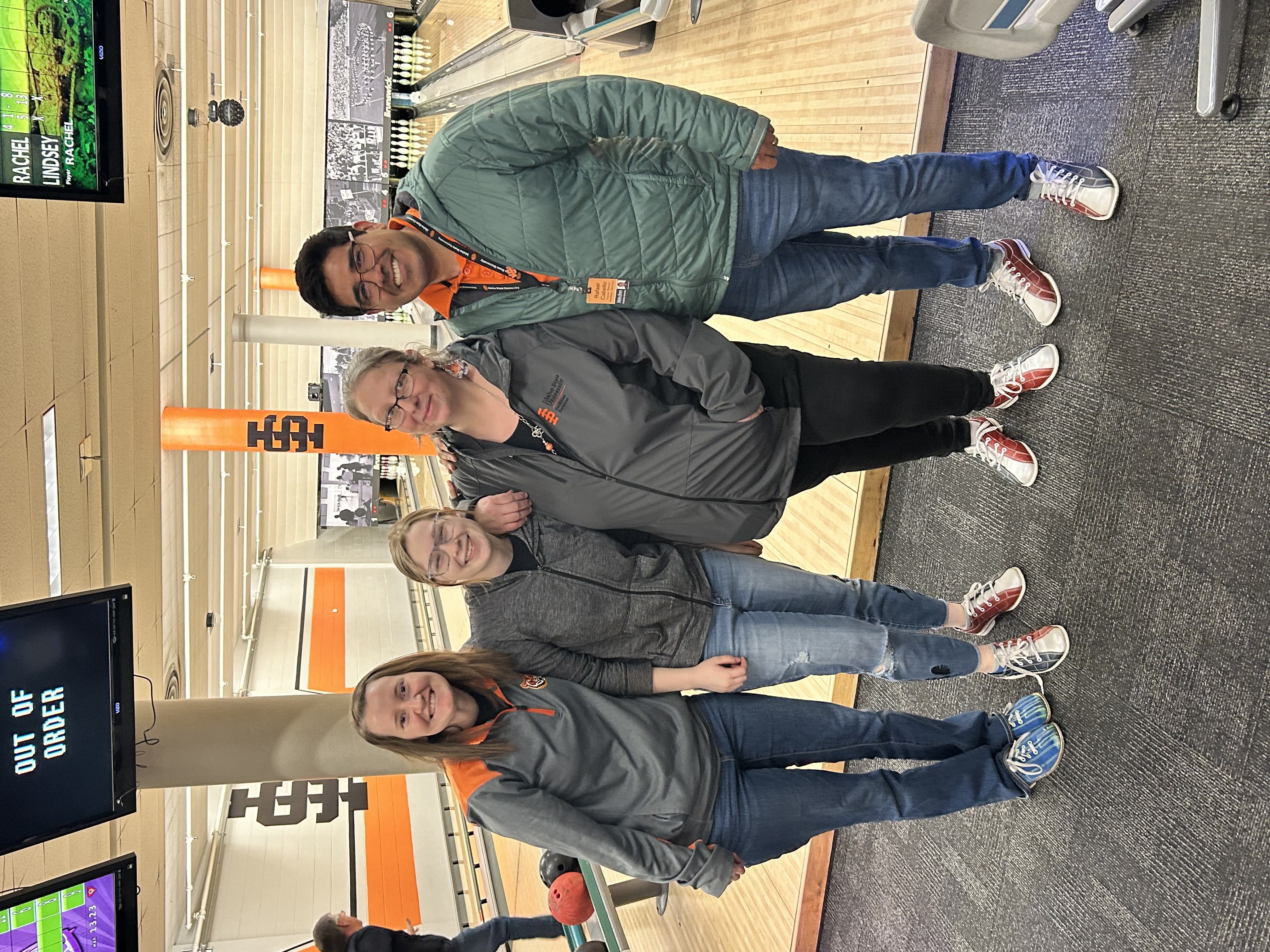 Four ISU employees pose for a photo at the ISU Bowling Alley