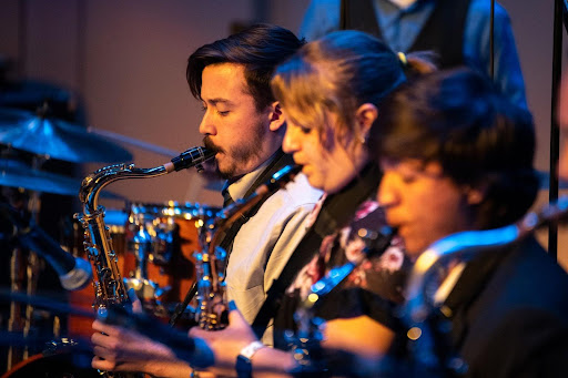 Performers playing the clarinet, drums and saxophone at the ISU Jazz Fest