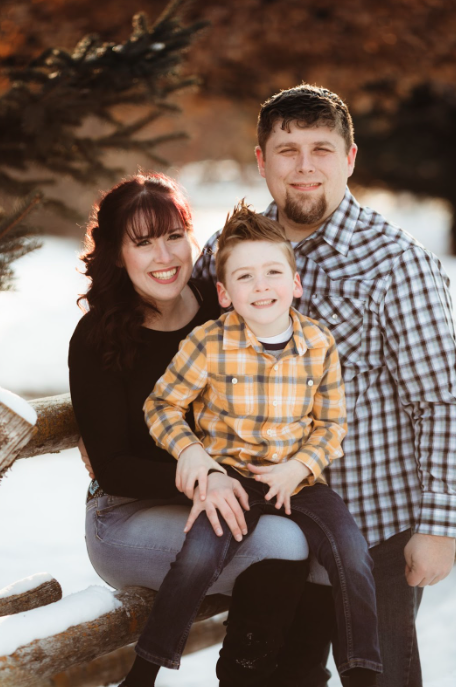 Phil Gamache, an ISU student with his wife and child