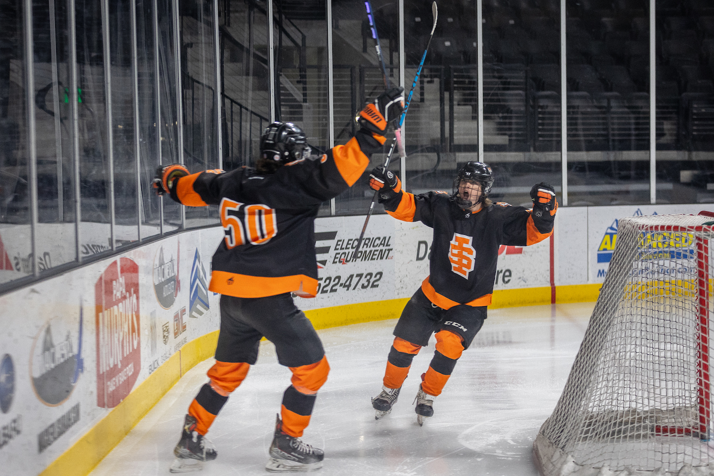 A man celebrates during a hockey game