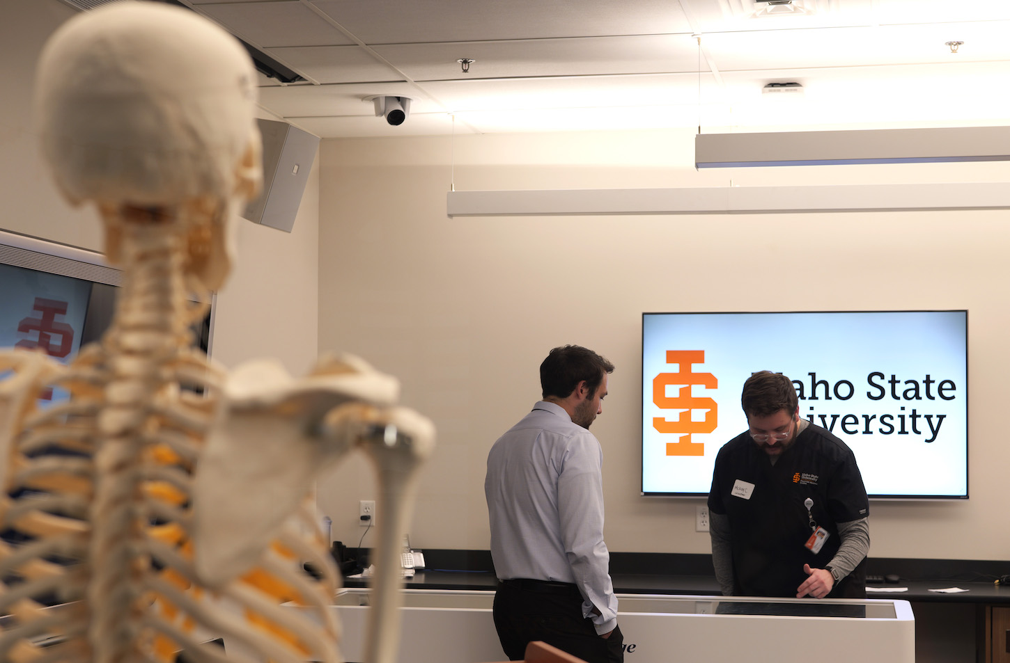 Two people in a classroom