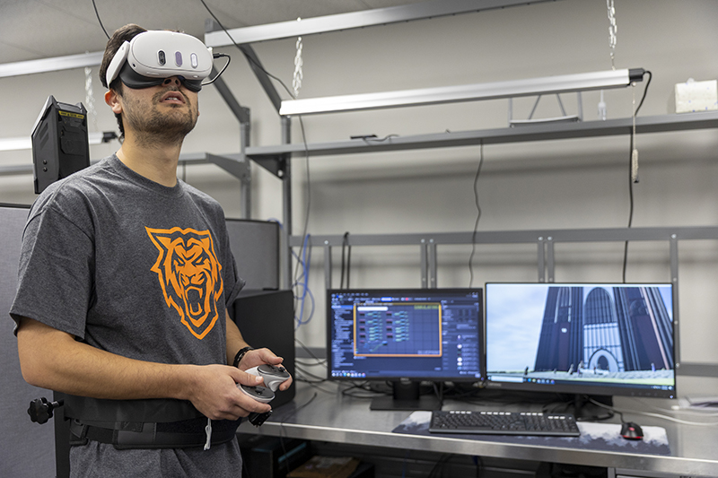 Reece Foulkrod, ISU student, plays Lit-VR, a virtual reality game set in 17th-century London.