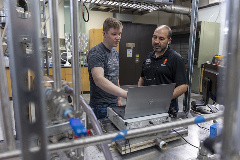 Scott Wahlquist, doctoral student, and Amir Ali, associate professor of nuclear engineering,  pose for a photo at the Center for Advanced Energy Studies in Idaho Falls.