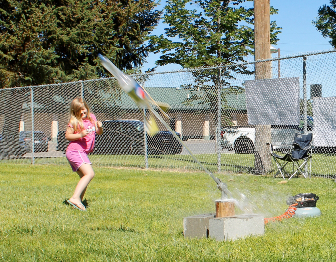Girl launches water rocket at festival in Pocatello’s Tydeman Park.