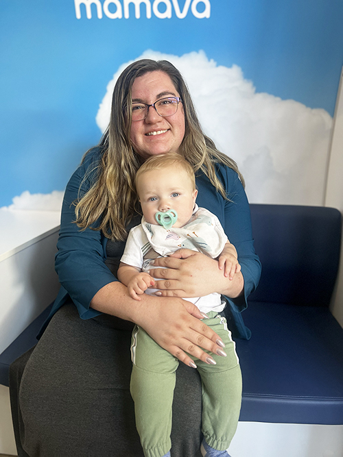 Jerrica Kenison with baby inside a new lactation pod at ISU
