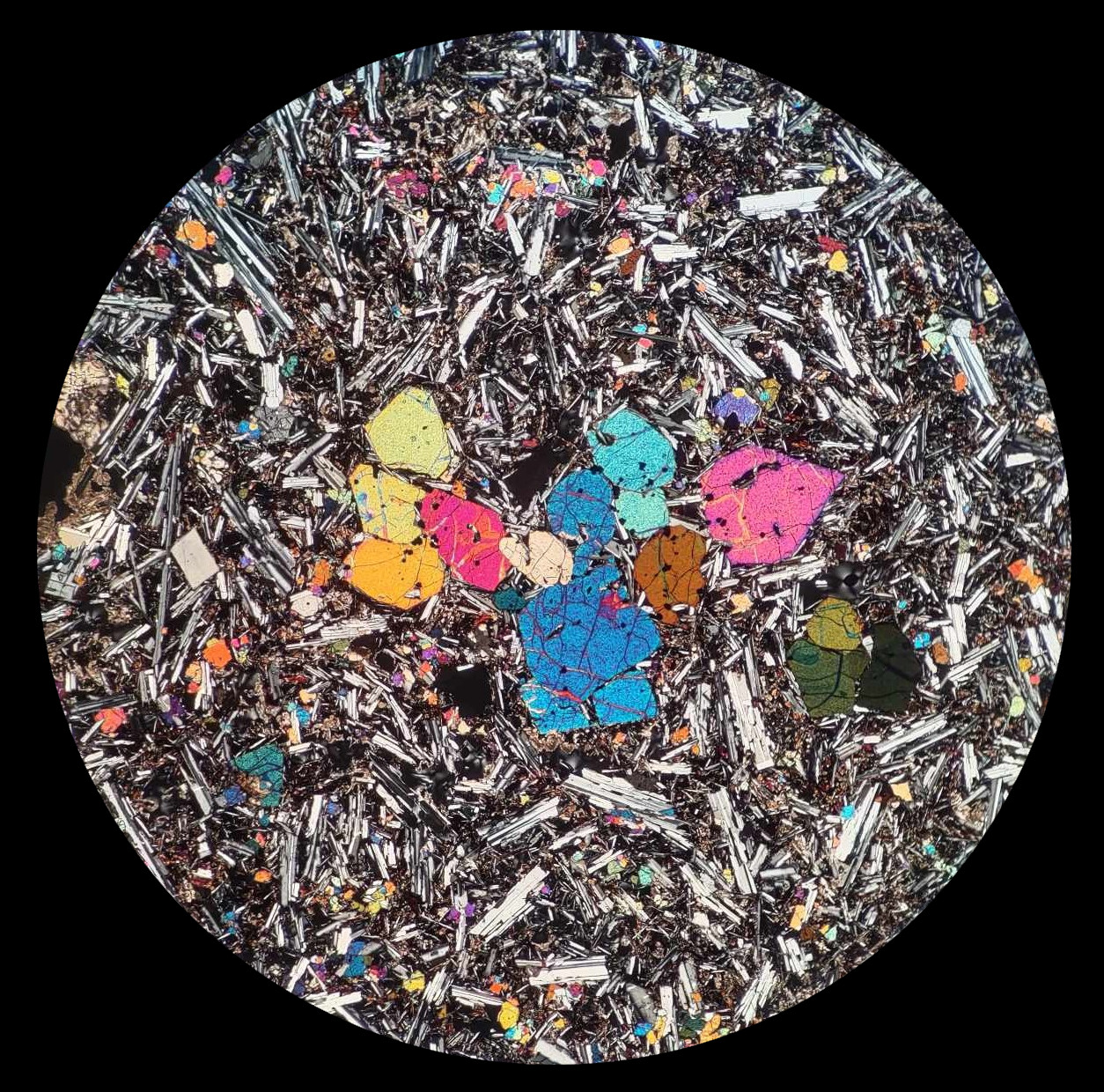 David Cavell's Microscopy Competition winning photo showing crystals of the mineral olivine