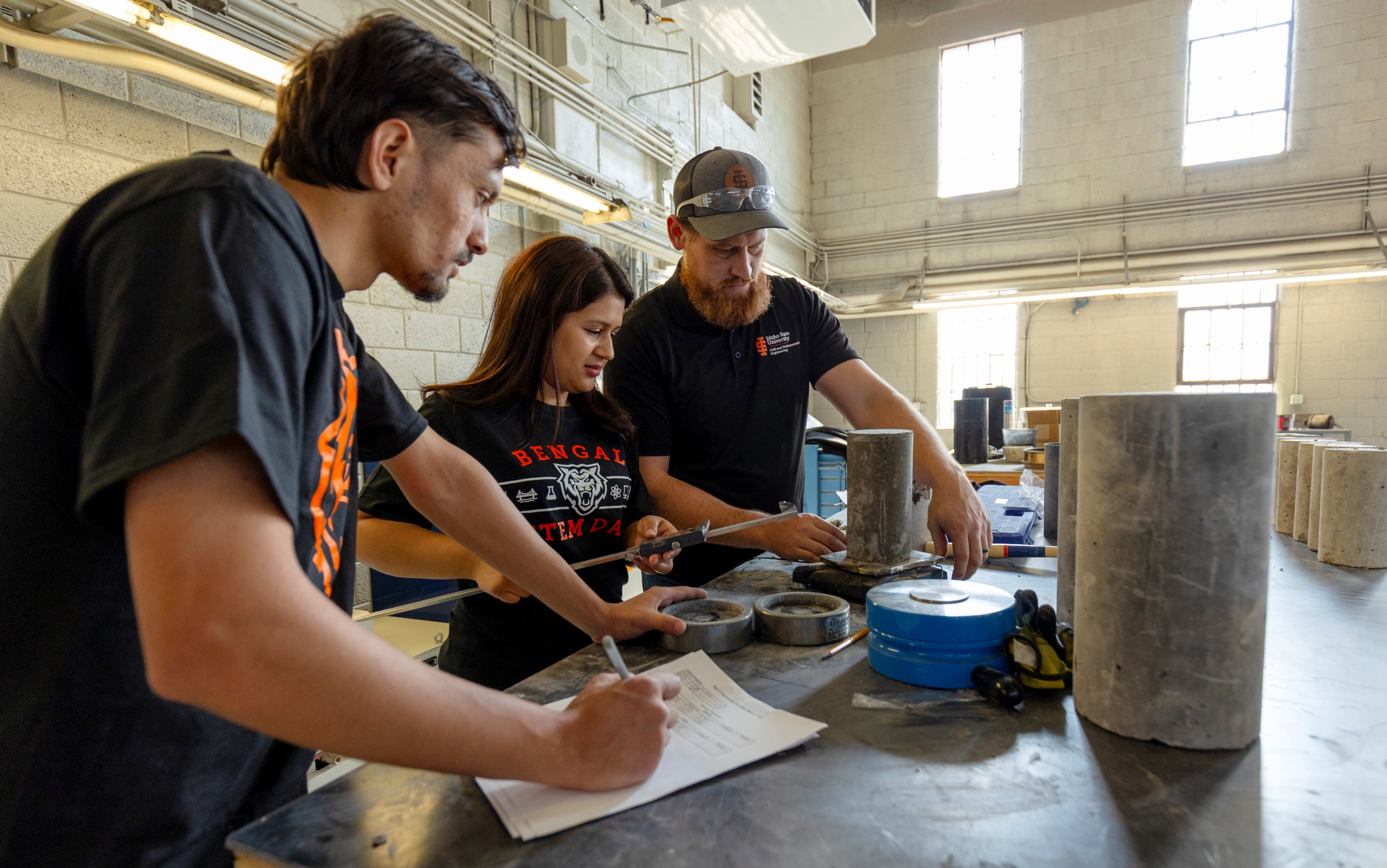 ISU students perform testing of a concrete used to build walls that will house nuclear reactors.