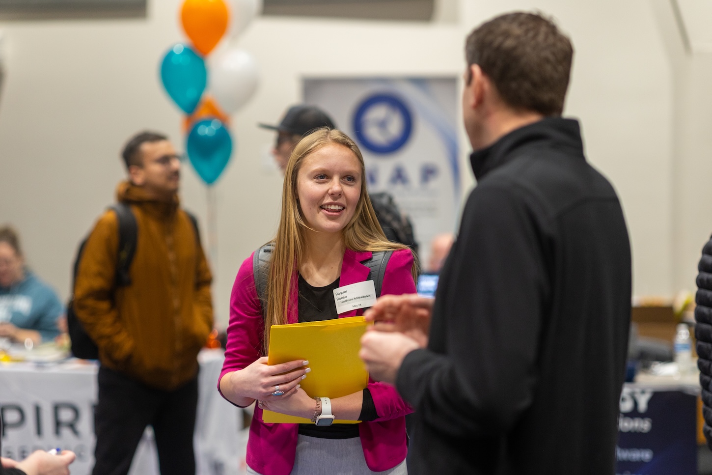 A student talks to an employer