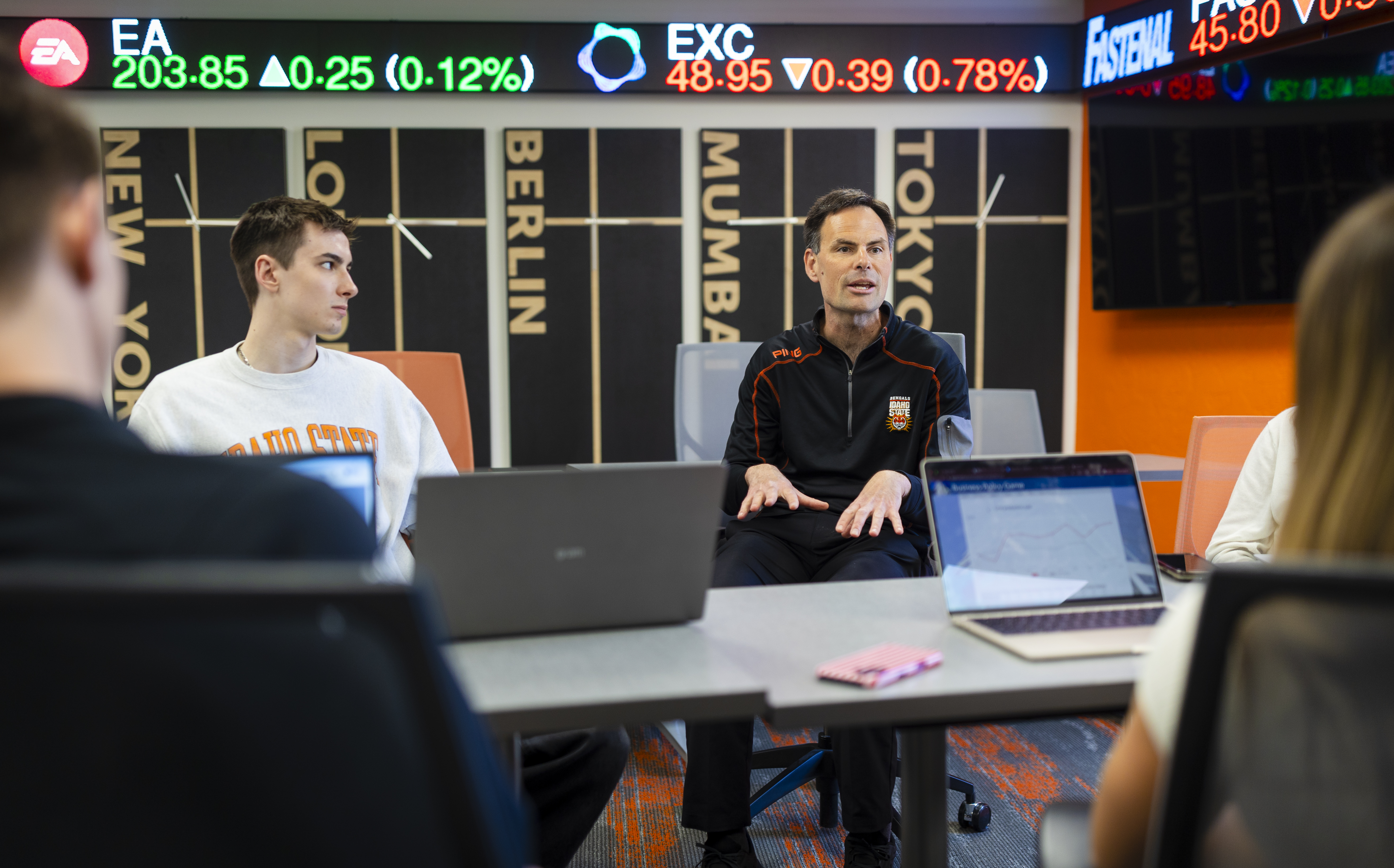 Alex Bolinger, Idaho Central Credit Union endowed professor of management, speaks with members of Idaho State’s International Collegiate Business Strategy Competition team.