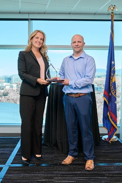 Man holding award
