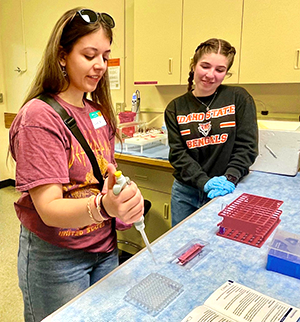 An attendee at a previous Bengal Bio Open House participates in an activity.