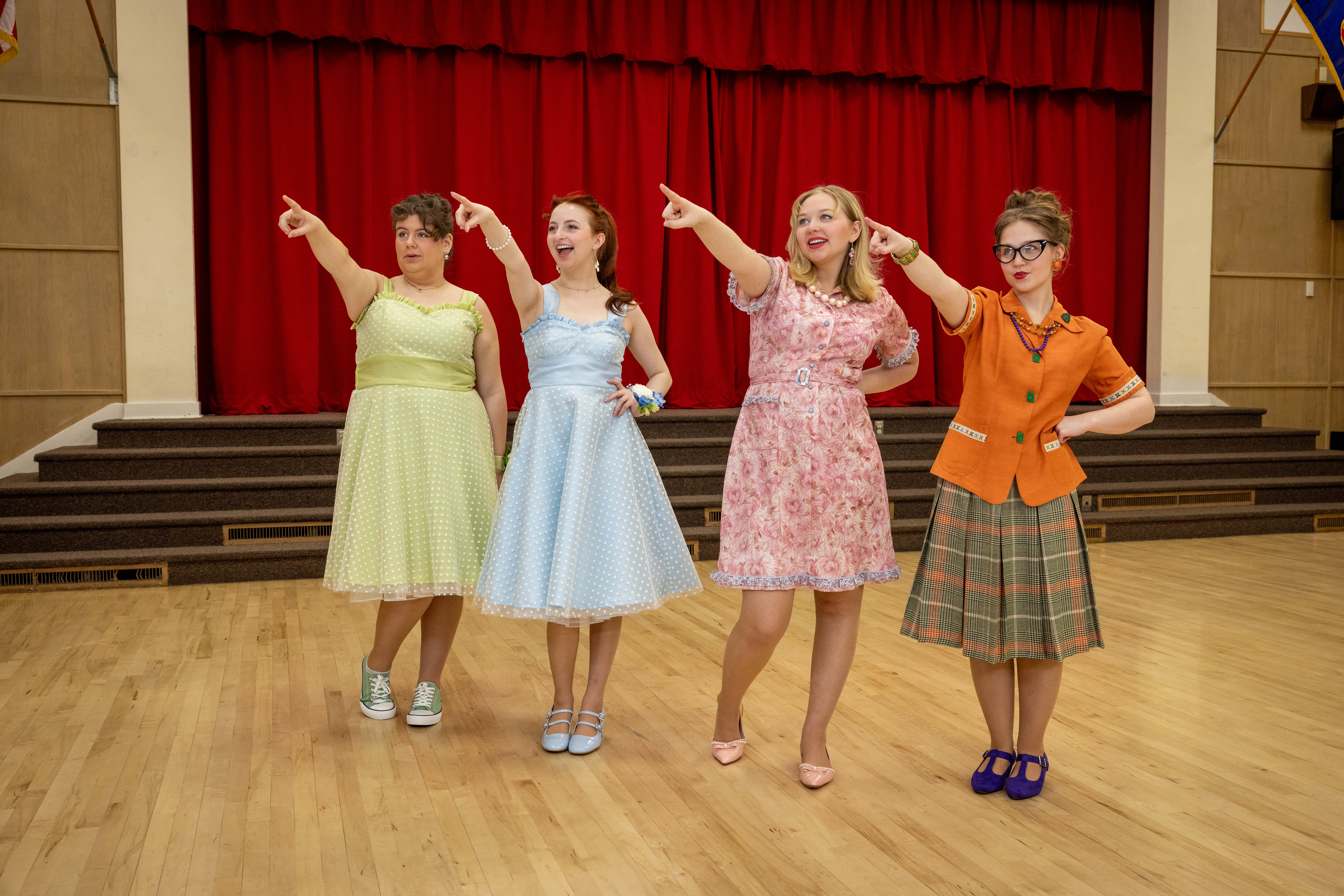 Singers performing in a gymnasium