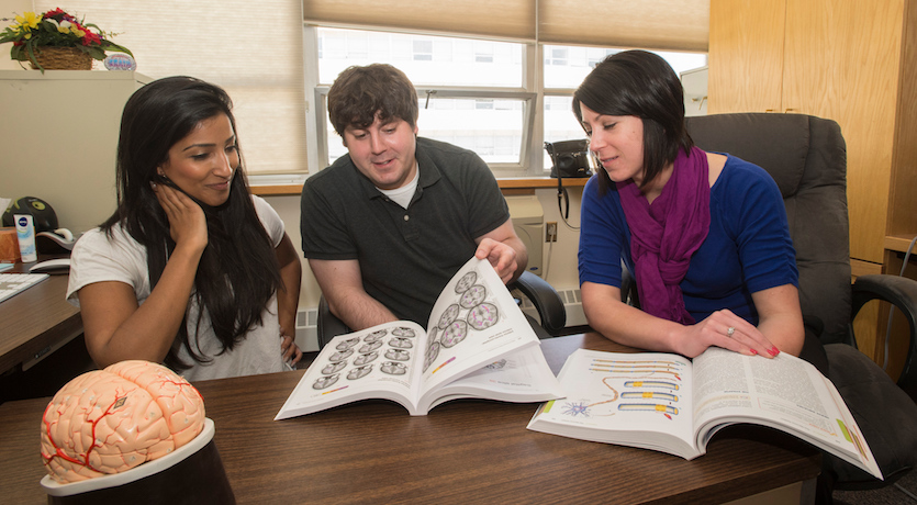 Generic photo of three students studying.