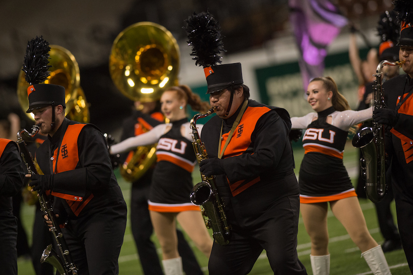 Photo of saxophone player and others in ISU Marching Band