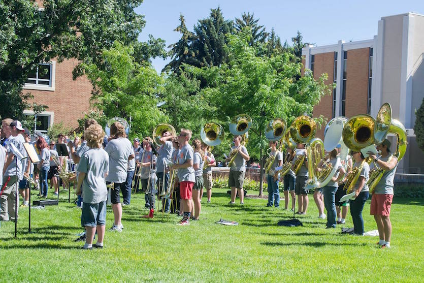Marching Band Camp students on the Hutchinson Quad playing their instruments.
