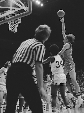 Steve Hayes, Bengal center, shoots a hook shot over defenders.